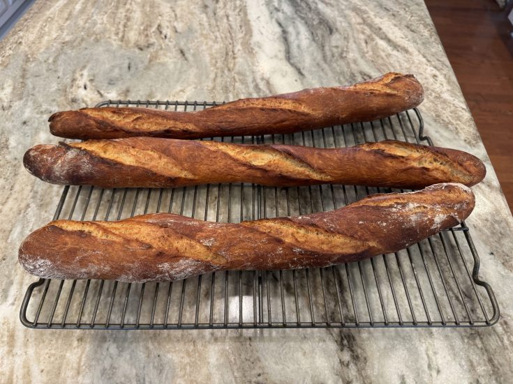 3 baguettes on a drying rack